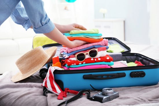 Woman packing a suitcase