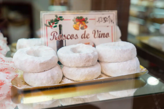Traditional Christmas “Roscos de Vino” in Málaga Traditional sugar-coated “roscos de vino” pastries in a Málaga bakery